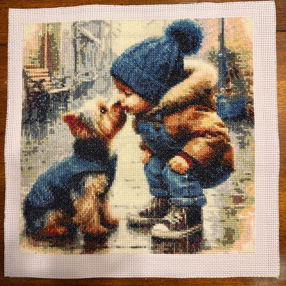 Cross Stitch Art of Child and Dog